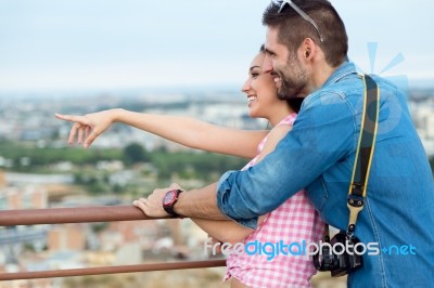 Young Tourist Couple Looking At The Views In The City Stock Photo