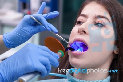 Young Woman At The Dental Office Stock Photo