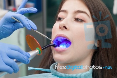 Young Woman At The Dental Office Stock Photo