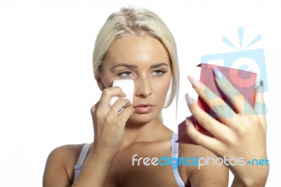 Young Woman Clean Face With Wet Wipes, Looking On Mirror In Hand… Stock Photo