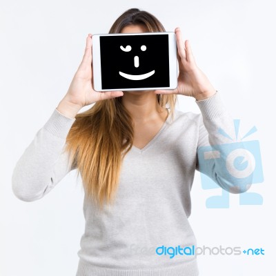 Young Woman Cover Her Face With Digital Tablet. Isolated On Whit… Stock Photo