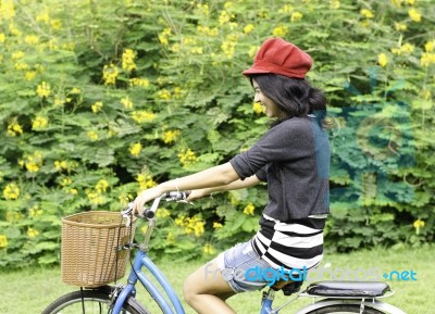 Young Woman Cycling And Having Fun Stock Photo