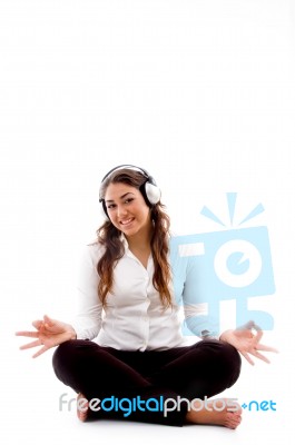 Young Woman Doing Meditation With Music Stock Photo