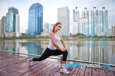 Young Woman Doing Stretching Exercise Stock Photo