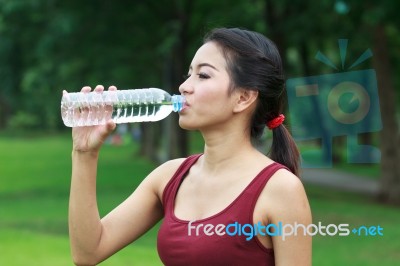 Young Woman Drinking Water Stock Photo