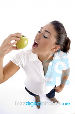 Young Woman Eating Apple Stock Photo