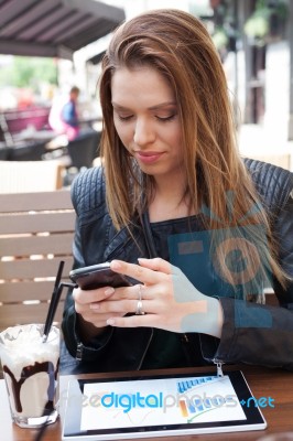 Young Woman Enjoying At Cafe Stock Photo