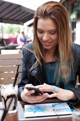 Young Woman Enjoying At Cafe Stock Photo