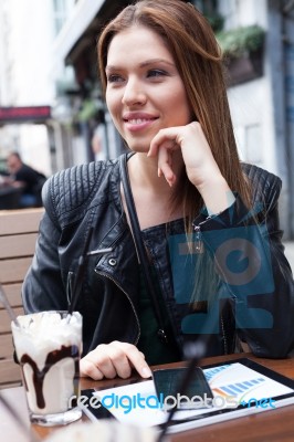 Young Woman Enjoying At Cafe Stock Photo