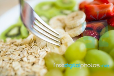 Young Woman Enjoying Breakfast At Home Stock Photo