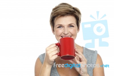 Young Woman Enjoying Her Coffee Stock Photo