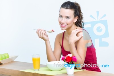 Young Woman Having Breakfast At Home Stock Photo