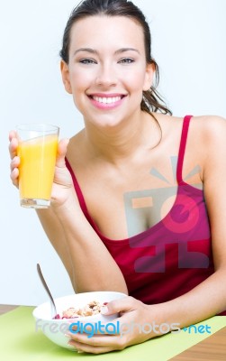 Young Woman Having Breakfast At Home Stock Photo