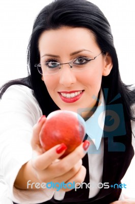 Young Woman Holding An Apple Stock Photo