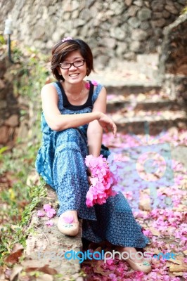 Young Woman Holding Paper Flower In Hand Stock Photo