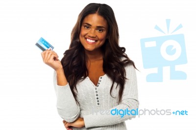 Young Woman Holding Up A Credit Card Stock Photo