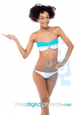 Young Woman In Bikini On A White Background Stock Photo