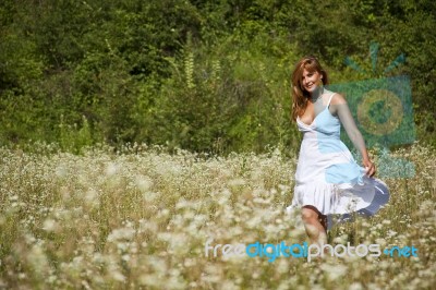 young Woman In Meadow Stock Photo