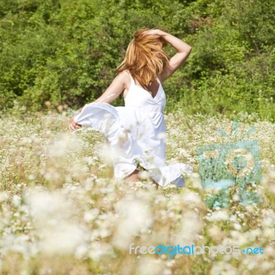 Young Woman In Meadow Stock Photo