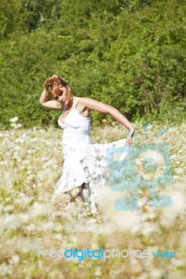 young Woman In Meadow Stock Photo