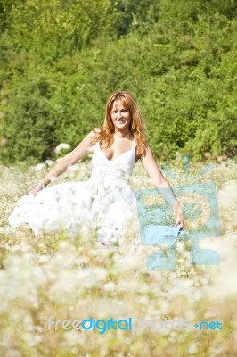 Young Woman In Meadow Stock Photo