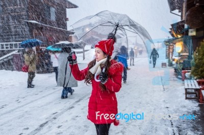 Young Woman In Shirakawa-go Village In Winter, Unesco World Heritage Sites, Japan Stock Photo