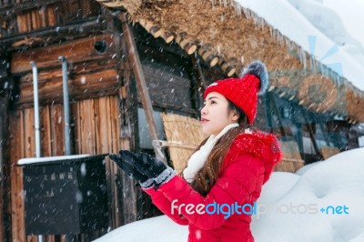 Young Woman In Shirakawa-go Village In Winter, Unesco World Heritage Sites, Japan Stock Photo