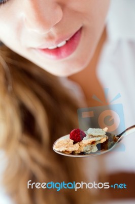 Young Woman In Underwear Eating Cereals. Isolated On White Stock Photo