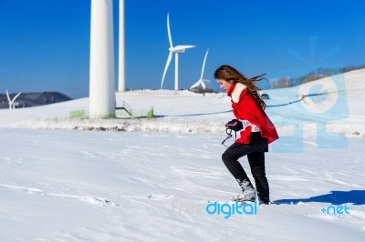 Young Woman Is A Happiness With Camera In Winter Of Sky And Winter Road With Snow And Red Dress Stock Photo