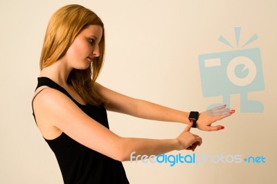 Young Woman Is Touching The Apple Watch Stock Photo