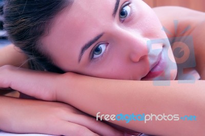 Young Woman Laying On Massage Bed Stock Photo