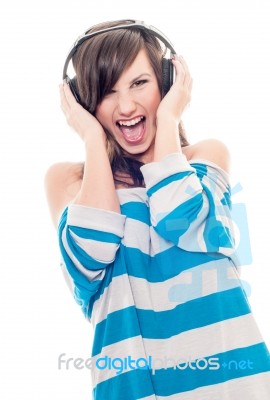 Young Woman Listening To Loud Music Stock Photo