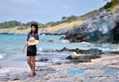 Young Woman On Beach Summer Holiday Stock Photo