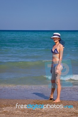 Young Woman On The Beach Stock Photo