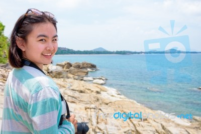 Young Woman Photography Near The Sea Stock Photo