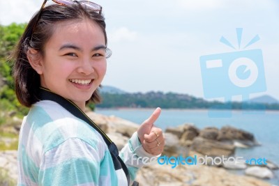 Young Woman Photography Near The Sea Stock Photo