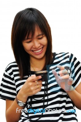 Young Woman Playing With Phone Stock Photo