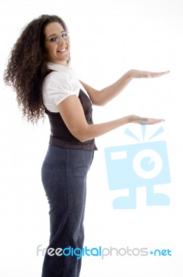 Young Woman Posing Like Holding Something With Hand Gesture Stock Photo