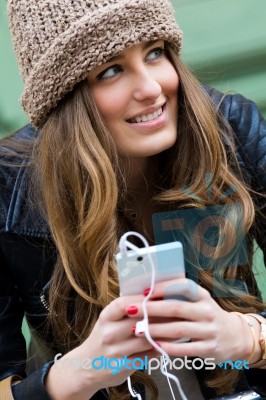 Young Woman Shopping In The City With His Mobile Phone Stock Photo