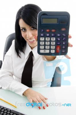 Young Woman Showing Calculator Stock Photo