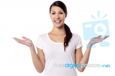 Young Woman Showing Open Hand Palms Stock Photo