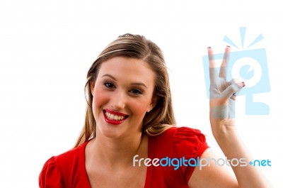 Young Woman Showing Winning Gesture Stock Photo