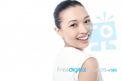 Young Woman Smiling Against White Stock Photo