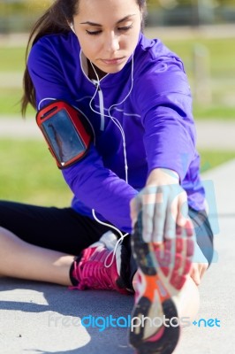 Young Woman Stretching And Preparing For Running Stock Photo