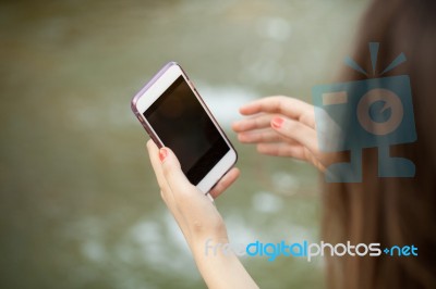 Young  Woman Taking A Photo With Her Phone Stock Photo