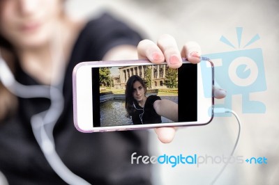 Young  Woman Taking A Photo With Her Phone Stock Photo