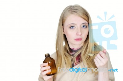 Young Woman Taking Syrup Stock Photo