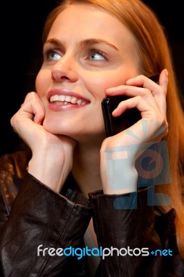 Young Woman Talking On Cell Phone Stock Photo