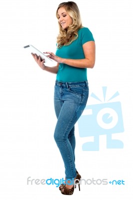 Young Woman Using A Digital Tablet Stock Photo