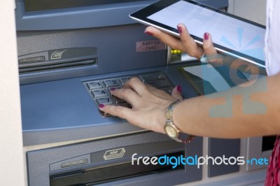 Young Woman Using Atm Machine Stock Photo